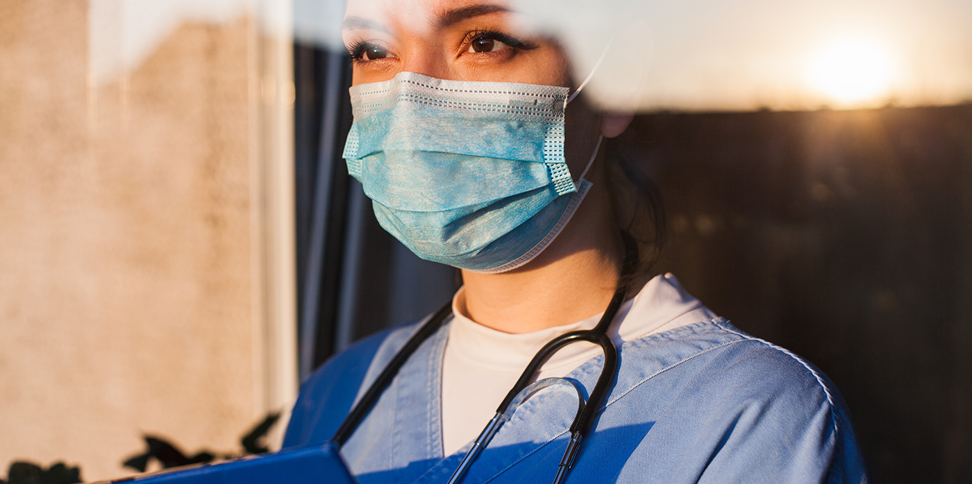Female doctor with surgical mask on