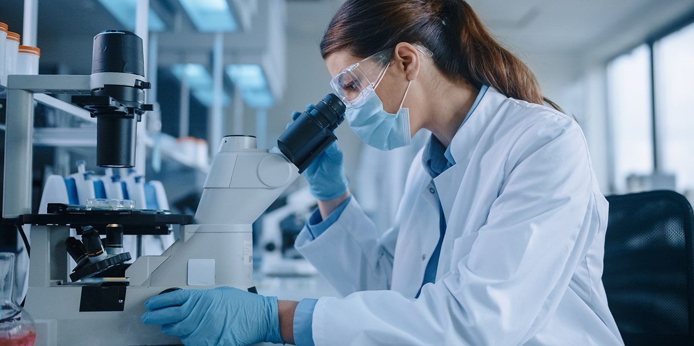 Idox Group News - Scientist conducting research in lab - UKRI publishes annual report