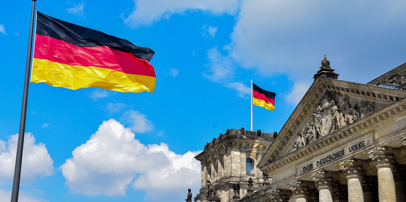 Idox Group News - German flag flying over the Reichstag - German Excellence Strategy
