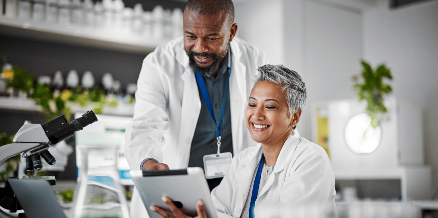 Idox Group News - Scientists working in a laboratory - REF policy 2028