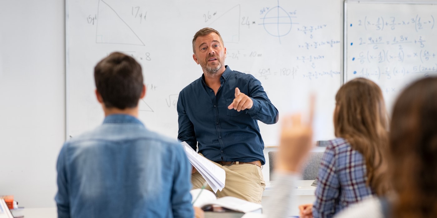 Idox Group News - Professor teching in a classroom - Quantum skills in School Fellowships