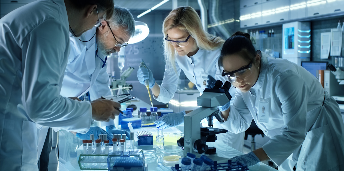 Scientists in a lab examining samples