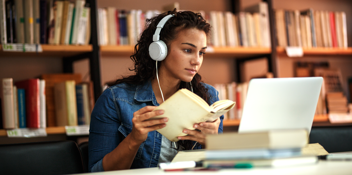 Student studying with headphones