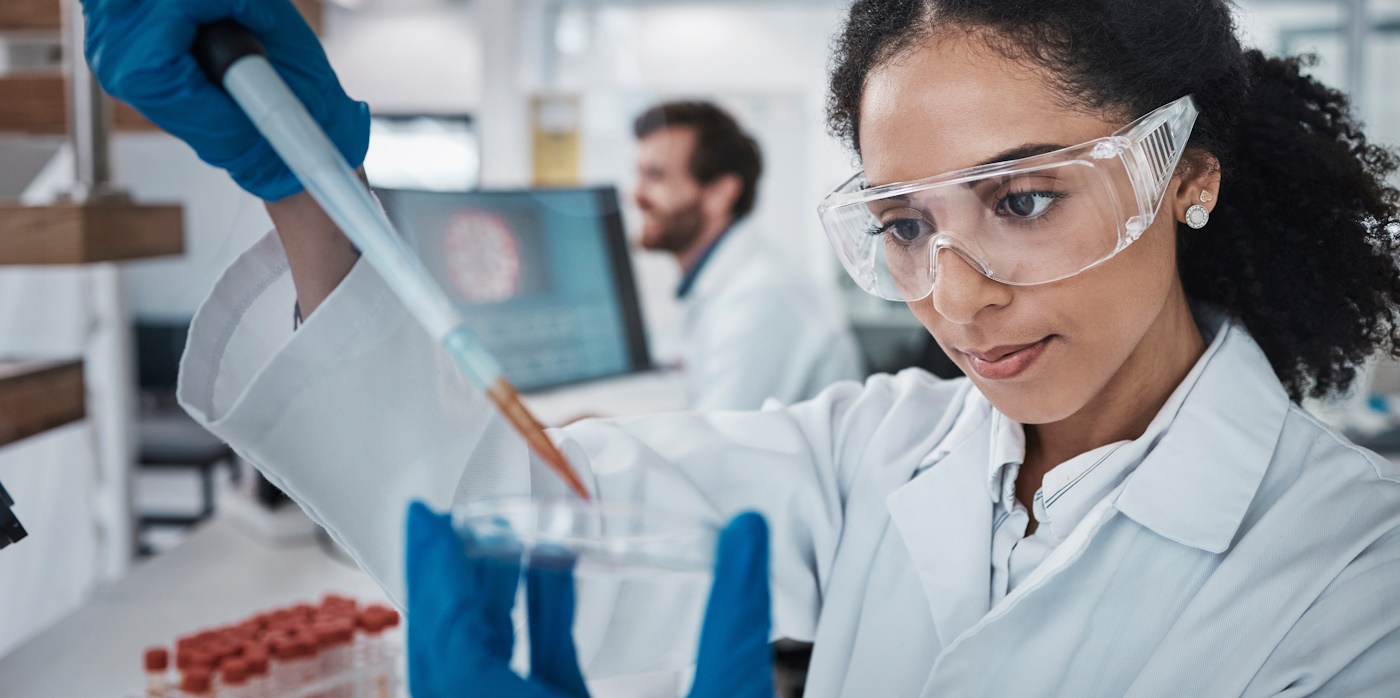 Scientist in a lab placing sample